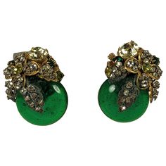 Miriam Haskell Ornate Emerald Gripoix Glass Earrings from the 1950's. Large emerald pate de verre cabs are embroidered with stones on Russian gilt filigrees in citrine, emerald, peridot and crystal. Superb hand made quality and striking size. 1 3/8" x 1" across. 1950's USA. Matching necklace available. Miriam Haskell, Matching Necklaces, Glass Earrings, Vintage Earrings, Citrine, Clip On Earrings, Emerald, Jewelry Earrings, Crystals