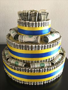 stacks of money wrapped in blue and yellow ribbon