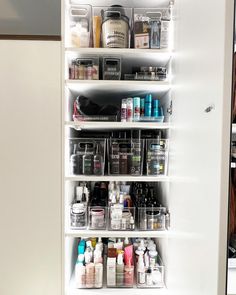 an open medicine cabinet filled with lots of bottles and other medical supplies on it's shelves