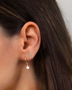 "An everyday go-to pair of huggie hoops. Simple, dainty and classy, these little star hoops are perfect for wearing stacked with other dainty hoops and studs. * Sold as a Pair * D E T A I L S * ∙ Material: .925 Sterling Silver or 18K Gold Plated over .925 Sterling Silver ∙ Dimensions: Hoop diameter: 11mm // Star charm: 8 mm ∙ Hypoallergenic & nickel-free * P A C K A G I N G * ∙ All jewelry is sent out beautifully packaged in our signature box & ready for gifting. ∙ In order to reduce was Hoop Earrings With Star Charm, Everyday Huggie Earrings With Star Charm, Minimalist Hoop Jewelry With Star Charm, Hoop Huggie Earrings With Star Charm, Dainty Hoop Earrings With Star Charm, Dainty Star-shaped Hoop Earrings For Everyday, Dainty Small Hoop Jewelry With Star Charm, Everyday Star-shaped Single Hoop Earring, Everyday Small Hoop Earrings With Star Charm