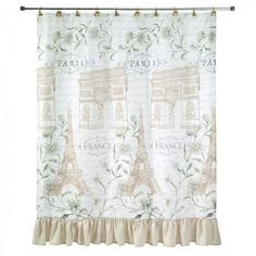 a curtain with the eiffel tower in paris on it, hanging from a metal rod