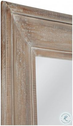 an old wooden frame mirror with white paint on the edges and bottom part of it