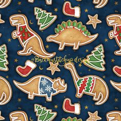 decorated christmas cookies on a blue background with trees, stars and other holiday decorations in the shape of dinosaurs