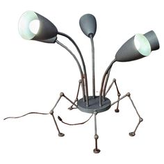 an anteater lamp with three lamps on it's legs and four lights in the middle