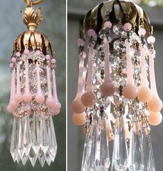 the chandelier is pink and gold with beads hanging from it's sides