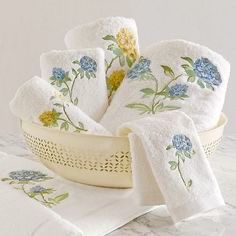 white towels with blue and yellow flowers on them