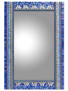 a mirror with blue and white designs on the border, in front of a white background