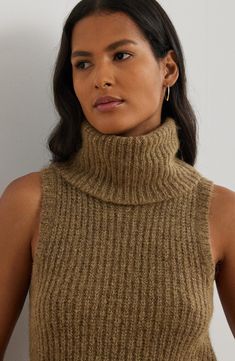 Take a bit of the spotlight everywhere you go in this sleeveless sweater knit from chunky alpaca- and wool-enriched yarns lit up with a touch of metallic thread. Turtleneck Sleeveless 45% recycled nylon, 26% alpaca, 24% wool, 5% other fibers Dry clean or hand wash, dry flat Imported Sleeveless Turtleneck Sweater, Lurex Sweater, Ralph Laurent, Ralph Lauren Womens Clothing, Sleeveless Turtleneck Sweaters, Sleeveless Jumper, Sweater Turtleneck, Sweater Tops, Beachwear Skirt