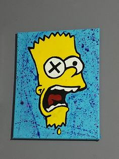 a painting of a cartoon character on a blue and yellow square with the word x painted on it