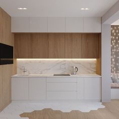 a kitchen with white cabinets and marble counter tops