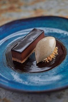 two pieces of chocolate on a blue plate