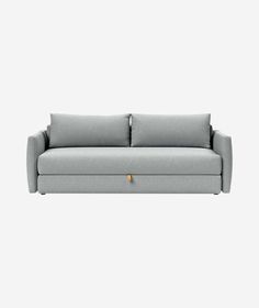 a gray couch sitting on top of a white floor