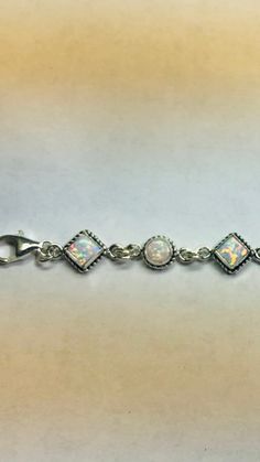 *Bracelet size is 8 inches long including extensions *Jewelry send out In Gift box *Sterling silver bracelet .925 *lab created opal *Handmade in Albuquerque NM.USA *Cabochons color may vary *Ship out within 48 hours guarantee on business days. Thank You For Your Looking ,And Check Out More Items In My Etsy Shop For More Great Deals, Also We Add More Jewelry To Etsy Shop Regularly https://www.etsy.com/shop/ABQdesign Classic Sterling Silver Bracelet With Extender As Gift, Classic White Adjustable Charm Bracelet, Classic Adjustable White Charm Bracelet, Adjustable Sterling Silver Bracelets With Extender, White Jewelry With Extender As A Gift, White Jewelry With Extender For Gift, White Sterling Silver Jubilee Bracelet Gift, Classic Sterling Silver Jewelry With Extender, Classic White Jewelry With Extender