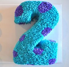 the number two is made out of blue and purple frosting