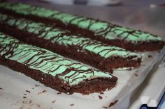 chocolate cake with green frosting on a tray