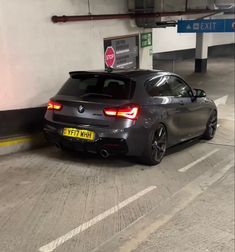 a bmw car parked in a parking garage