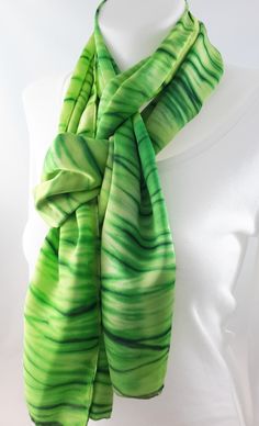 Hand painted silk scarf. Colours used - different shades of green. Design - dyed using the Japanese shibori technique of pole wrapping. Dimensions approx 35cm x180cm / 14 x 72 inches (the steam setting process may cause a little shrinkage). 100% silk satin, a little heavier than my other smooth scarves (weight 12 momme - medium). All edges are hand finished. I have used silk dyes (not paints) as these bond with the fibre of the silk after steam setting, to ensure colour permanence,  more intense Artistic Hand Painted Green Silk Scarf, Artistic Hand-dyed Green Scarves, Artistic Hand Dyed Green Silk Scarf, Hand Painted Green Silk Scarf, Silk Painting Techniques, Japanese Shibori, Shibori Techniques, Silk Scarf Painting, Different Shades Of Green