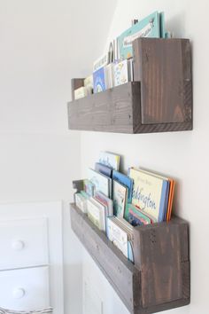 two wooden shelves with books on them