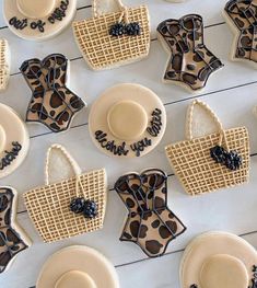 decorated cookies and waffles are arranged on a table