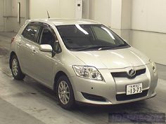 a silver car is parked in a garage