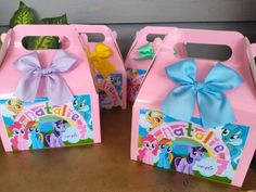 three little pony boxes with bows on them