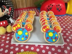 mickey mouse cookies are arranged on a plate