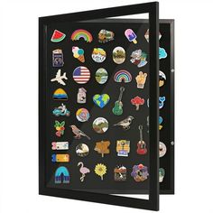 a black framed display case filled with lots of stickers and magnets on it