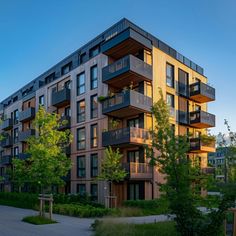 an apartment building with many balconies and trees