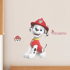 a wall decal with a cartoon dog wearing a red fireman's hat