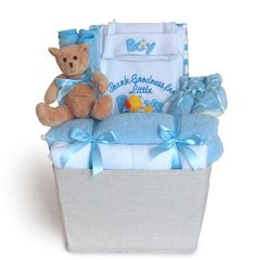 a baby gift basket with a teddy bear and blanket