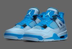 the nike air jordan iv's blue and white color scheme is seen in this image