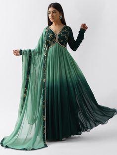 A two-piece bottle green anarkali set from the Suruchi Parakh collection. This gorgeous georgette anarkali is paired with a green dupatta. The bottle green anarkali has intricate sequin embroidery in the yoke and enhanced with a graceful pleated ombre flare. There is a cutout neckline along with a tassel tie-up at the back. The green dupatta is bordered with sequin and pearl thread work. Anarkali With Dupatta, Anarkali Dress Pattern, Blush Pink Dresses, Indian Gowns, Designer Party Wear Dresses, Party Wear Indian Dresses, Dress Indian Style, Stylish Dress Book, Gathered Sleeves