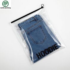 a pair of jeans in a plastic bag with the word hoodie printed on it