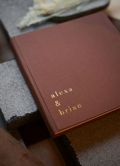 a brown book sitting on top of a wooden table