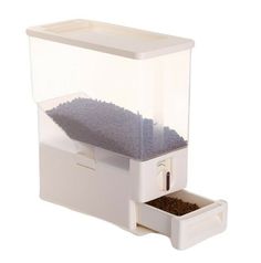 a bird feeder with its lid open and food in it's drawer on a white background