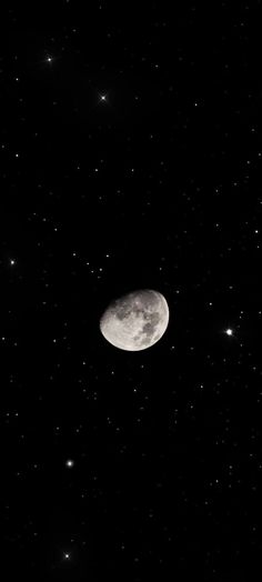 the moon is in the dark sky with many stars around it, and there are only one object visible