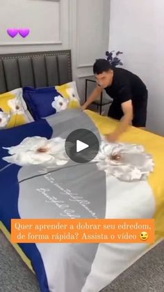 a man is placing flowers on a bed