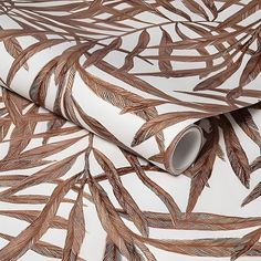 a white and brown wallpaper with metallic foil leaves on the back of it's wrapper