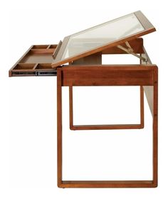 a wooden table with a glass top and drawer on the bottom, in front of a white background