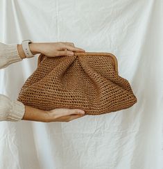 Trendy raffia Pelmeni clutch bag with soft, voluminous pleats that completely hide the model's frame, giving it a rounded shape. A model for stylish women living in big cities, for whom practicality is as important as beauty. Take her to work in the office or to deal with everyday worries. Closes with magnets. Inside: one compartment inside. Cloud bag is available to order in Size: XL: Height  - 9.05 inches (23 cm) Width of the bag itself is  - 17.71 inches (45 cm) Depth - 7.87 inches (20 cm) * Chic Textured Summer Bags, Brown Pouch Clutch With Braided Handles, Brown Leather Clutch With Braided Handles For Daily Use, Chic Brown Handheld Clutch, Elegant Brown Straw Bag For Spring, Chic Rectangular Summer Pouch, Chic Brown Straw Clutch Bag, Chic Natural Clutch With Braided Handles, Chic Natural Clutch For Spring