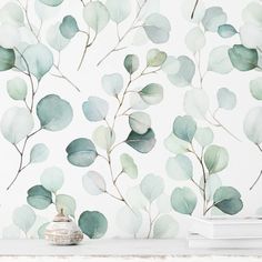 the wallpaper is decorated with green leaves