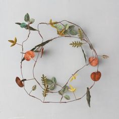 a wreath made out of leaves and twigs