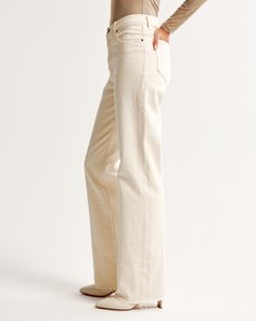 Our classic relaxed jeans in a neutral bone wash with a raw hem. This fit features a 10.5” high rise, is fitted at the waist and hips, and eases at the thigh into a relaxed, full-length leg shape. This jean is made from our vintage stretch fabric which features both an authentic vintage look and contains slight built-in stretch for additional comfort. High Rise 90s Relaxed Jean, Female Features, Color Bone, Bone Color, Relaxed Jeans, Vintage Look, Vintage Looks, Abercrombie Fitch, Gender Female