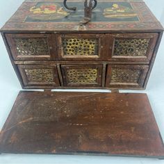 an old wooden chest with ornate designs on it