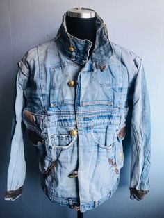 "Vtg denim recycled into a new garment - fully lined  Size is large / XL Pit to pit 46\"  Pit to cuff 22\"  Fantastic  re worked denim jkt  2/3 pairs of Levi's re sewn together to make a new denim jkt  Leather trim on cuffs & pockets  Collar & waistbands are literally waist band from jeans  Very creative & imaginative  Very unique & possibly rare" Vintage Rigid Denim Outerwear With Pockets, Vintage Rigid Denim Jacket For Fall, Rugged Denim Outerwear With Pockets, Vintage Denim Outerwear For Fall, Rugged Denim Jacket With Pockets For Streetwear, Vintage Jeans With Pockets For Fall, Vintage Pre-washed Fall Jeans, Vintage Jeans For Fall Streetwear, Urban Recycled Denim Outerwear With Pockets