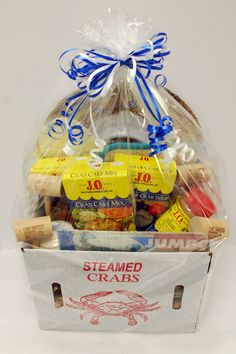 a white basket filled with lots of different types of food and condiments in it