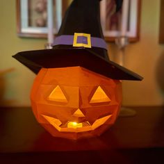 a pumpkin with a witches hat on it