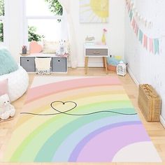 a child's room with a rainbow rug on the floor