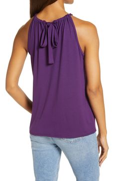 A stretchy knit and a shoulder-showing design put this halter-neck tank at the top of both the comfy and cute wardrobe rankings. 23" length Ties at neck Halter neck Sleeveless, with cutaway shoulders 95% rayon, 5% spandex Machine wash, dry flat Imported Women's Clothing Sleeveless Tie-back Top, Versatile Sleeveless Halter Top With Tie Back, Solid Color Cotton Halter Neck Tops, Chic Stretch Top With Tie Back, Casual Tie Neck Tops For Summer, Casual Stretch Halter Top Sleeveless Blouse, Stretch Cami Top With Tie Back, Stretch Tie-back Cami Top, Versatile Solid Sleeveless Blouse