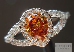 "CENTER STONE: WEIGHT: 0.47ct QUANTITY: 1 SHAPE: Pear Brilliant COLOR: Fancy Deep Yellowish Orange CLARITY: SI1 MEASUREMENTS: 5.88 x 4.51 x 2.78 mm TOTAL DEPTH: 61.6% FLUORESCENCE: NONE GIA COLOR REPORT #: 2145916252 SIDE STONES: TOTAL WEIGHT: 0.52cts QUANTITY: 63 SHAPE: Round Brilliant COLOR: F-G CLARITY: VS MOUNTING: Platinum and 18Karat Yellow Gold Currently sized at: 6 We will ship the ring in your size. The stone's vibrant color comes through in this ring. It's not a \"pure\" orange, but le Canary Diamond Ring, Fancy Color Diamond Ring, Pear Diamond Ring, Orange Diamond, Colored Diamond Jewelry, Pear Diamond Rings, Yellow Diamond Rings, Fancy Diamonds, Bling Rings